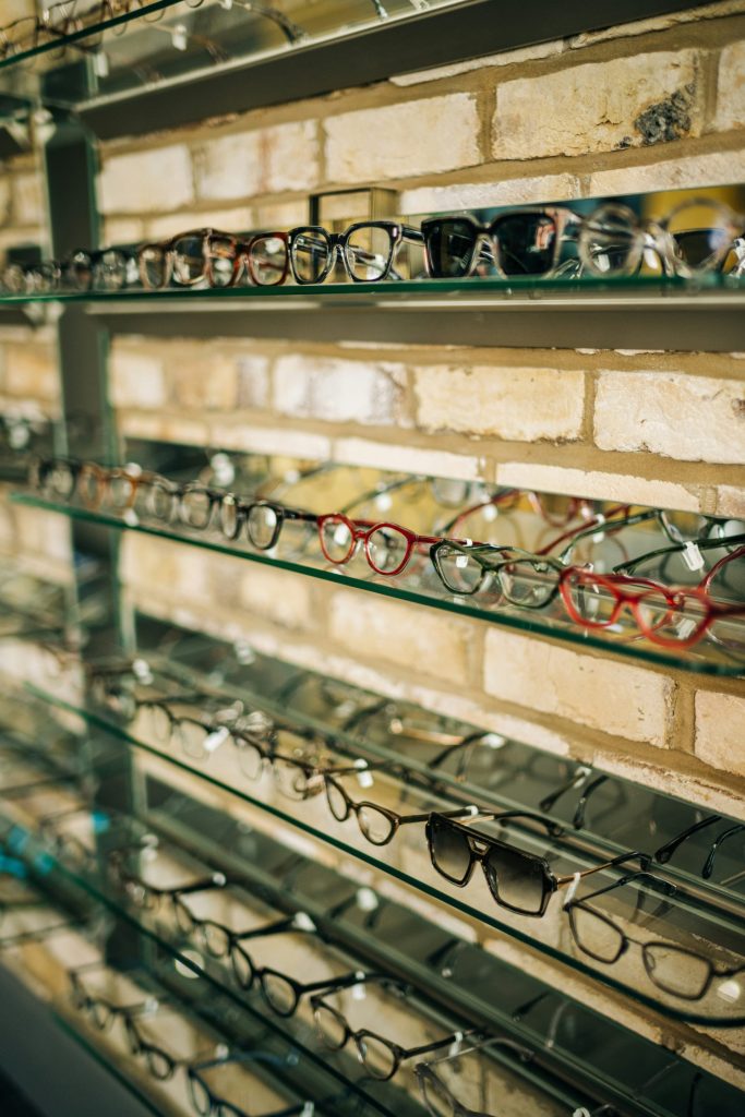 a display case with many pairs of glasses